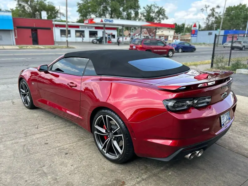 Red Chevy Camaro convertible, rear three quarter view