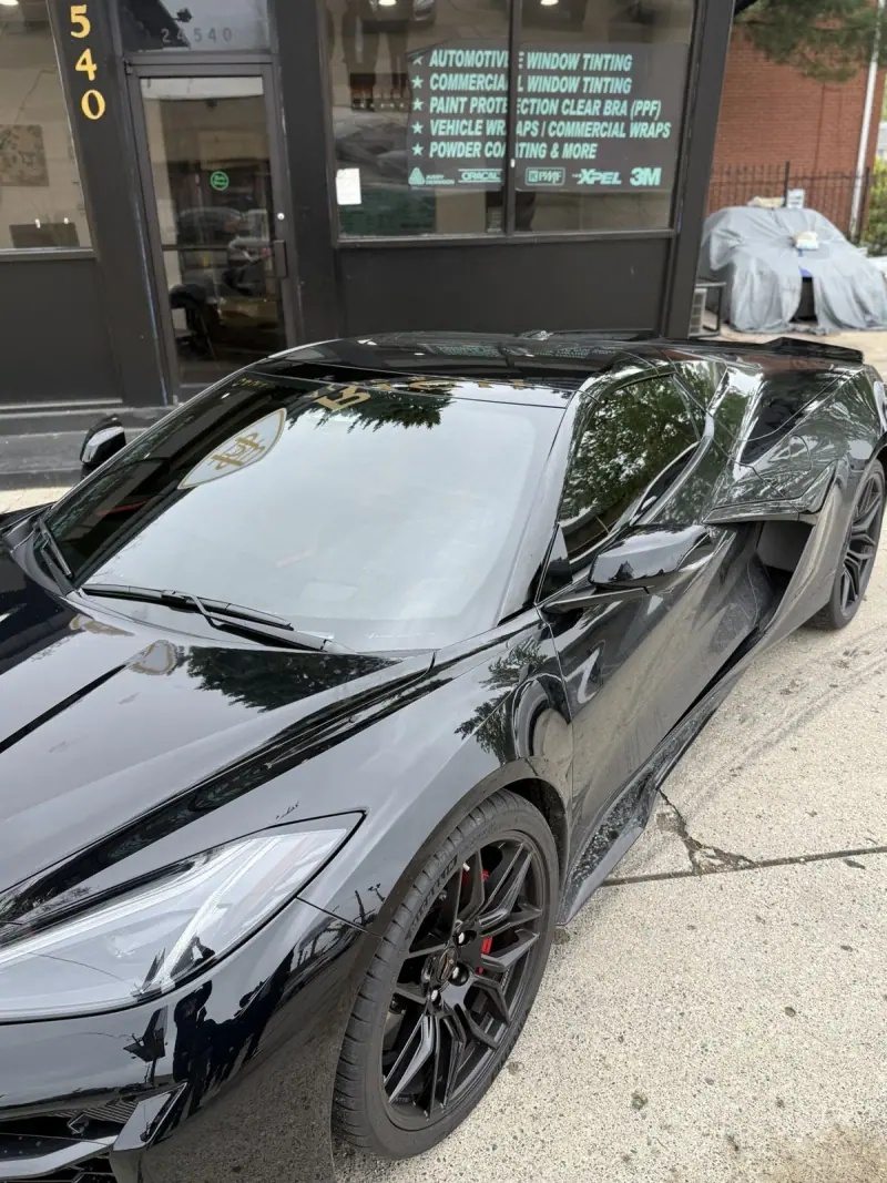 Black Chevy Corvette C8, side view