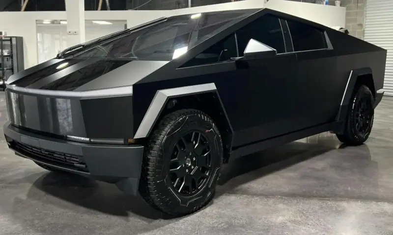 Matte black Tesla Cybertruck inside a showroom