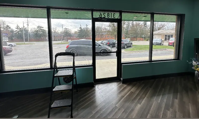 Storefront windows before window film, seen from inside
