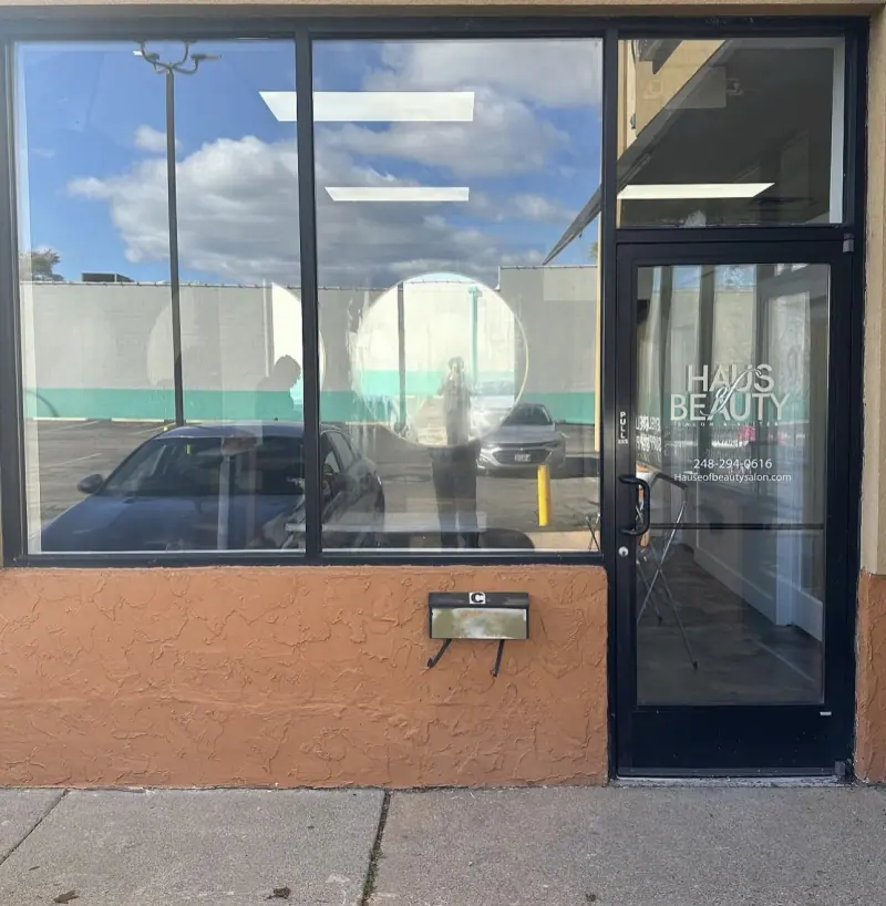 Salon storefront windows before window film