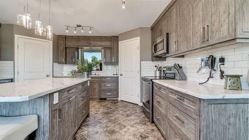 Kitchen cabinets wrapped in a wood grain vinyl