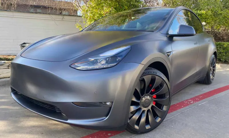 Satin gray Tesla Model Y, front three quarter view