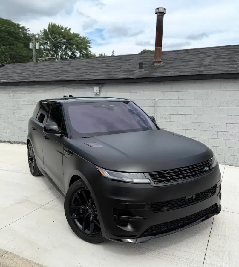 Matte black Range Rover Sport, front three quarter view