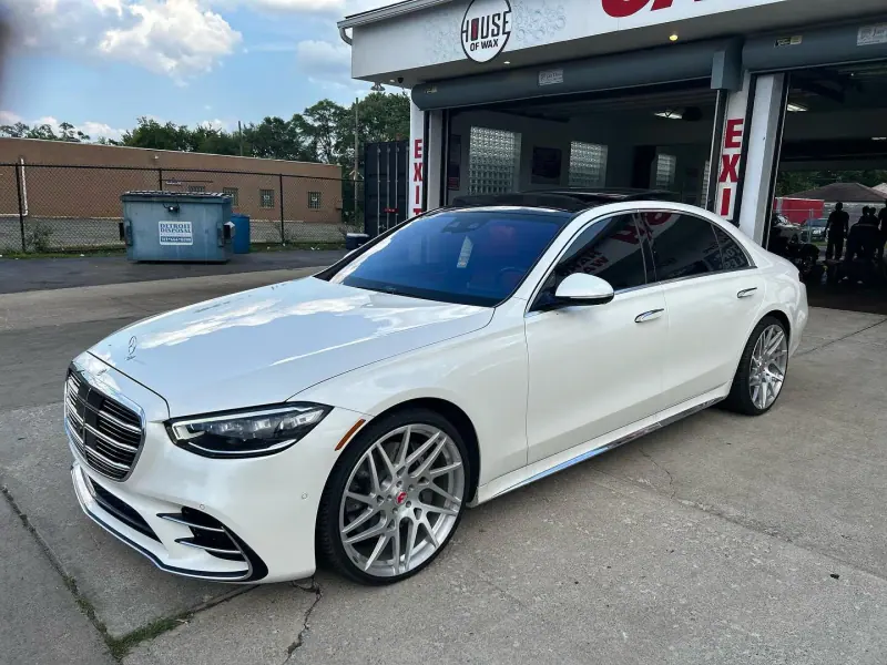 White Mercedes S class, front three quarter view