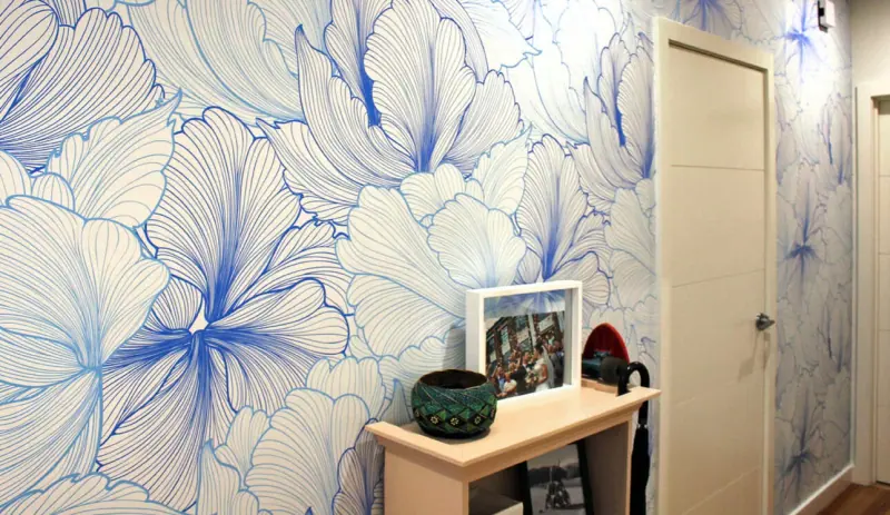 Blue floral printed vinyl wall wrap in a hallway