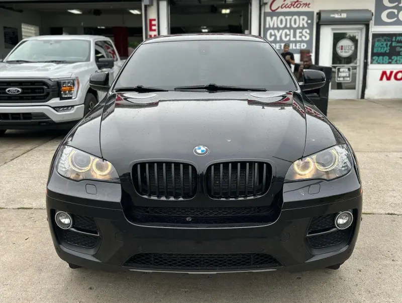 Black BMW X6, front view